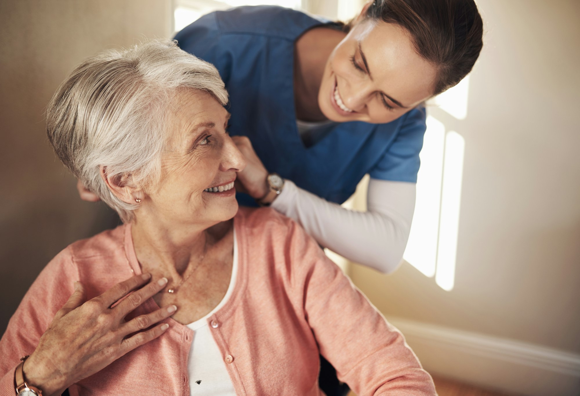 Shot of a senior woman in a wheelchair being cared for a nurse